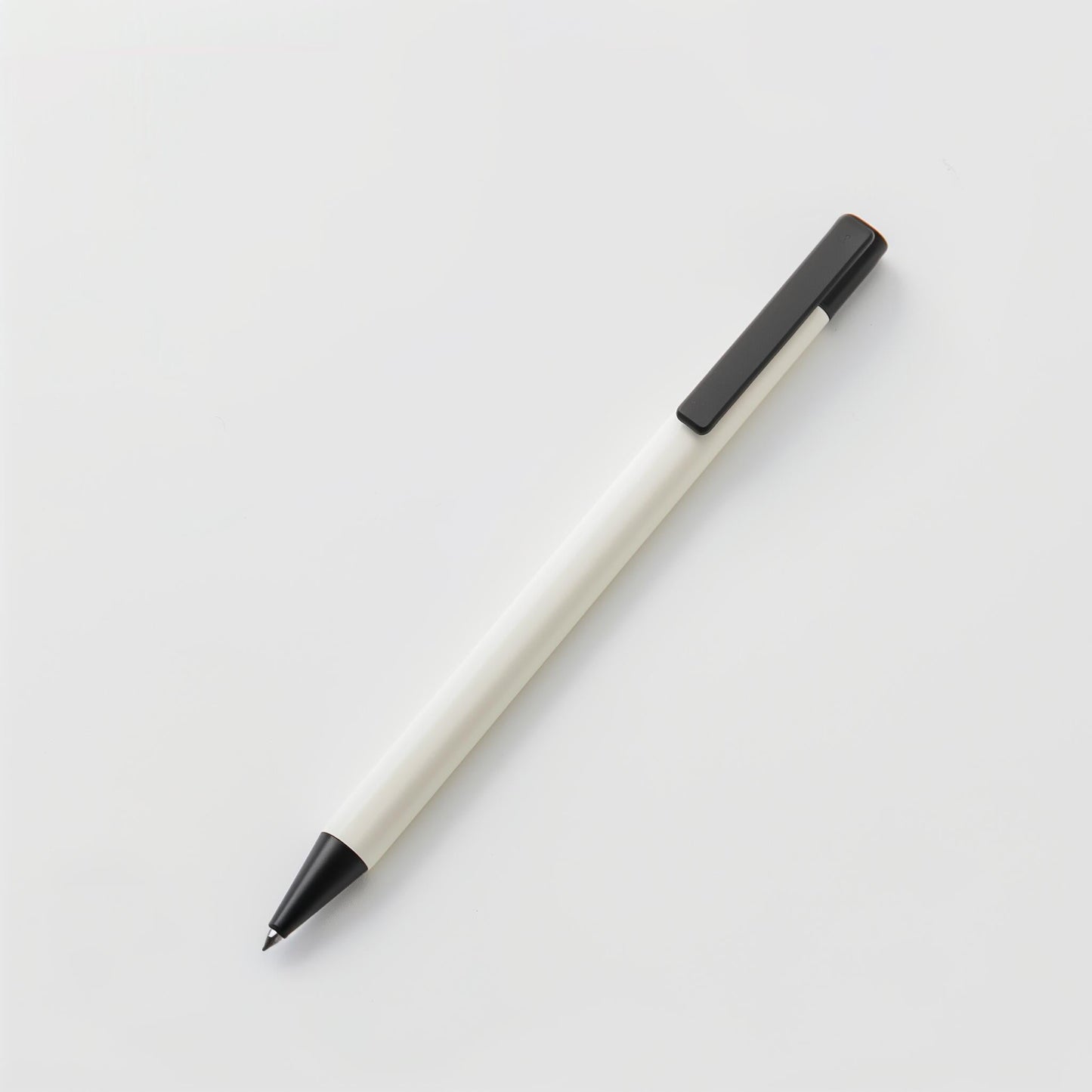 The Example product, a black and white ballpoint pen with a black clip, rests diagonally on a plain white background.